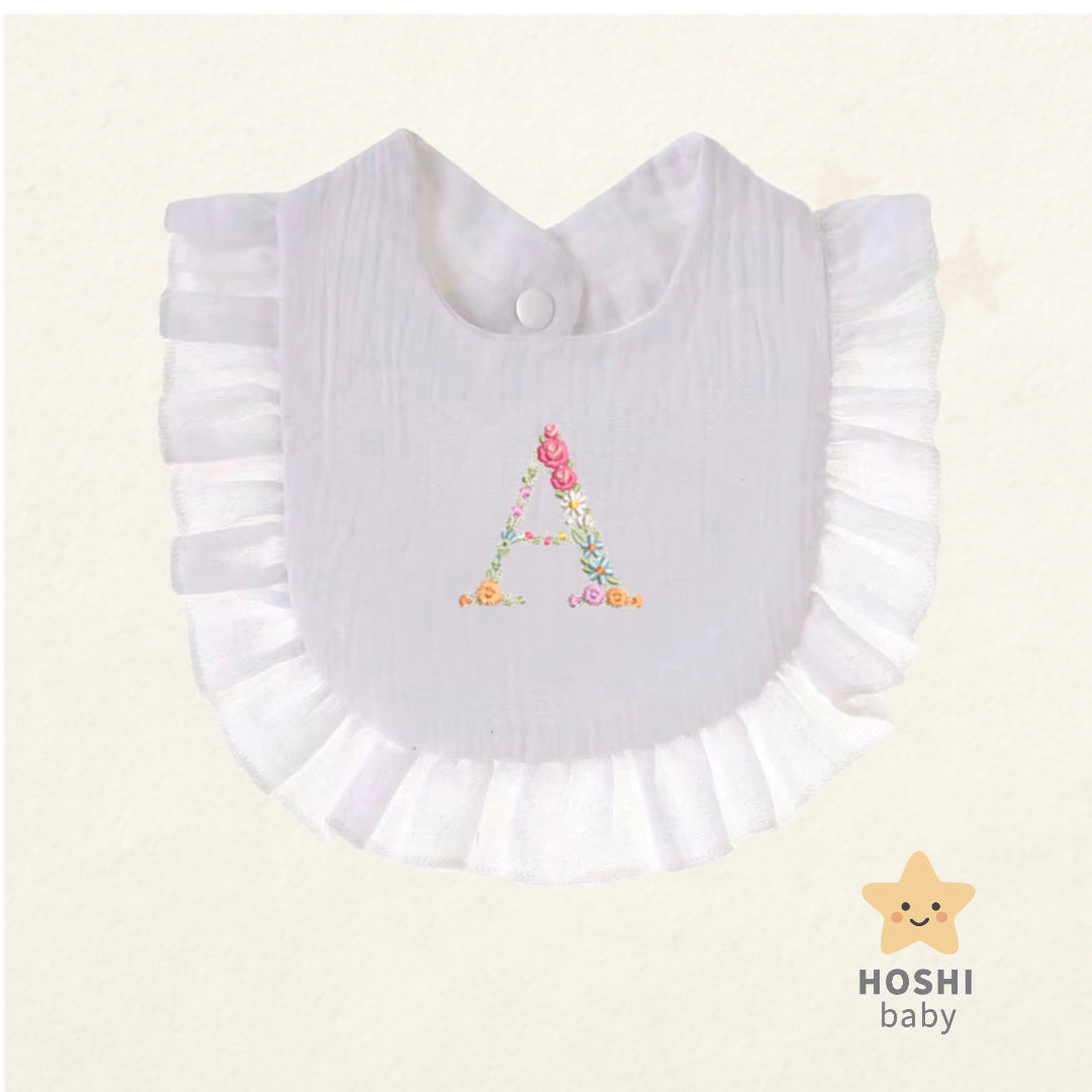 Babero muselina Inicial Flores